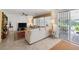 Bright living room featuring a comfortable sectional sofa and sliding glass door at 3179 Surf Spray St, Las Vegas, NV 89117