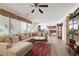An open living space with comfortable sectional sofa and lots of natural light at 3179 Surf Spray St, Las Vegas, NV 89117