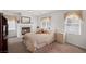 Bright main bedroom with fireplace and large window at 3179 Surf Spray St, Las Vegas, NV 89117