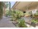 Relaxing covered patio with hanging plants, perfect for outdoor entertaining and serene relaxation at 3179 Surf Spray St, Las Vegas, NV 89117