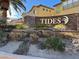 Tides community entrance with stonework and landscaping at 8010 Arcadian Ln, Las Vegas, NV 89147