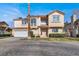 Two-story house with attached garage and landscaped front yard at 8010 Arcadian Ln, Las Vegas, NV 89147