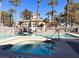 Community pool and spa with palm trees at 8010 Arcadian Ln, Las Vegas, NV 89147