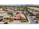 Aerial view of single-Gathering home with pool and landscaped yard at 3870 Valles Caldera Ct, Las Vegas, NV 89118