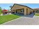 Home exterior showcasing backyard patio, grass and gravel at 3870 Valles Caldera Ct, Las Vegas, NV 89118