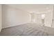 Spacious loft area with grey carpet and open railing at 8897 Faxom St, Las Vegas, NV 89166