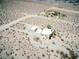 Vast desert landscape featuring home with separate structure, offering privacy and scenic views at , Pahrump, NV 89060