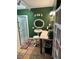 Well-lit bathroom features a shower, pedestal sink, shelving, and earth-toned tile flooring at , Pahrump, NV 89060