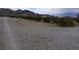 Long gravel driveway showcasing the desert landscape surrounding the property at , Pahrump, NV 89060