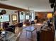 Spacious living room with hardwood floors, beamed ceiling, unique decor, and bright natural lighting at , Pahrump, NV 89060