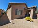 House exterior showcasing backyard, landscaping, and covered patio at 6072 Corbin Ave, Las Vegas, NV 89122