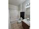 Clean bathroom with a bathtub, toilet and vanity at 6072 Corbin Ave, Las Vegas, NV 89122