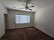 Spacious bedroom with carpeted floor, window blinds, and ceiling fan at 6072 Corbin Ave, Las Vegas, NV 89122