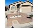 Tan house with a two-car garage and nicely landscaped front yard at 6072 Corbin Ave, Las Vegas, NV 89122