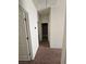 Clean hallway with carpet and access to bedrooms and bathroom at 6072 Corbin Ave, Las Vegas, NV 89122