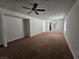 Living room features brown carpet and a ceiling fan at 6072 Corbin Ave, Las Vegas, NV 89122