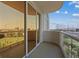 Balcony with golf course view through sliding glass doors at 135 E Harmon Ave # 1020, Las Vegas, NV 89109
