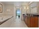 Spacious bathroom featuring a soaking tub, double sinks, and a walk-in shower at 135 E Harmon Ave # 1020, Las Vegas, NV 89109