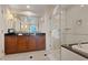 Elegant bathroom with double vanity, shower, and city views at 135 E Harmon Ave # 1020, Las Vegas, NV 89109