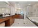 Luxurious bathroom features dual vanities, a soaking tub, and a separate shower at 135 E Harmon Ave # 1020, Las Vegas, NV 89109