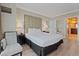 Main bedroom with plush bedding and access to bathroom at 135 E Harmon Ave # 1020, Las Vegas, NV 89109