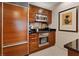 Modern kitchen features stainless steel appliances and sleek black countertops at 135 E Harmon Ave # 1020, Las Vegas, NV 89109
