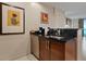 Kitchen with dark wood cabinets, stainless steel appliances, and a sink at 135 E Harmon Ave # 1020, Las Vegas, NV 89109