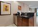 Kitchenette with sink, dishwasher, and storage, perfect for snacks and beverages at 135 E Harmon Ave # 1020, Las Vegas, NV 89109