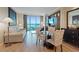 Inviting suite with modern furniture, dining area, and expansive windows with scenic city views at 135 E Harmon Ave # 1020, Las Vegas, NV 89109