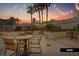 Enjoy the outdoor patio with a cozy fire pit, comfortable seating, and lush landscaping at 135 E Harmon Ave # 1020, Las Vegas, NV 89109