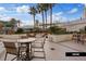 Relaxing patio area with seating, fire pit, and lush landscaping at 135 E Harmon Ave # 1020, Las Vegas, NV 89109