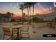 Evening view of the patio area with string lights and seating at 135 E Harmon Ave # 1020, Las Vegas, NV 89109