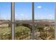 Stunning window view of the cityscape and putting green from inside the condo at 135 E Harmon Ave # 1020, Las Vegas, NV 89109