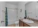 Bathroom with tub/shower, granite countertop vanity, neutral ceramic tile floor, and a toilet at 3558 E Malheur Ave, Pahrump, NV 89061