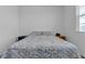 Cozy bedroom with soft patterned bedding, neutral walls, and minimal decor for peaceful rest at 3558 E Malheur Ave, Pahrump, NV 89061