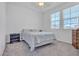 Bright bedroom features neutral walls, plush bedding, and lots of natural light at 3558 E Malheur Ave, Pahrump, NV 89061
