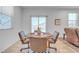 Cozy dining area offers a blend of natural light and comfortable seating at 3558 E Malheur Ave, Pahrump, NV 89061