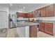 Well-lit kitchen with stainless steel appliances, granite counters and a large center island at 3558 E Malheur Ave, Pahrump, NV 89061