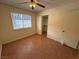 Bedroom with natural light, standard ceiling fan, and ample closet space at 213 N Lamb Blvd # D, Las Vegas, NV 89110