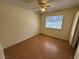 Bedroom with tile flooring, ceiling fan, and natural light from the window at 213 N Lamb Blvd # D, Las Vegas, NV 89110