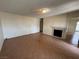 Inviting living room featuring tile flooring and a cozy fireplace, perfect for relaxation and gatherings at 213 N Lamb Blvd # D, Las Vegas, NV 89110