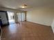 Bright living room with tile flooring, seamlessly connecting to the outdoor area through a sliding glass door at 213 N Lamb Blvd # D, Las Vegas, NV 89110