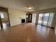 Open-concept living room with tile flooring, a fireplace, and easy access to outdoor spaces for entertaining at 213 N Lamb Blvd # D, Las Vegas, NV 89110