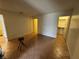 Neutral living room featuring tile flooring, white walls, and multiple doorways at 213 N Lamb Blvd # D, Las Vegas, NV 89110