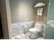 Clean bathroom featuring a toilet, marble tile, and towel rack at 4381 W Flamingo Rd # 11306, Las Vegas, NV 89103