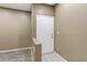 The entryway boasts fresh paint, white tile flooring, and a solid door at 5655 E Sahara Ave # 1052, Las Vegas, NV 89142