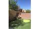 Private backyard with putting green and water feature at 9229 Millikan Ave, Las Vegas, NV 89148