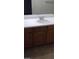 Bathroom vanity with sink and wooden cabinets at 9229 Millikan Ave, Las Vegas, NV 89148