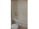 Clean bathtub with tiled surround and shelves at 9229 Millikan Ave, Las Vegas, NV 89148