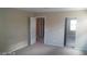 Bright bedroom with a door to another room at 9229 Millikan Ave, Las Vegas, NV 89148